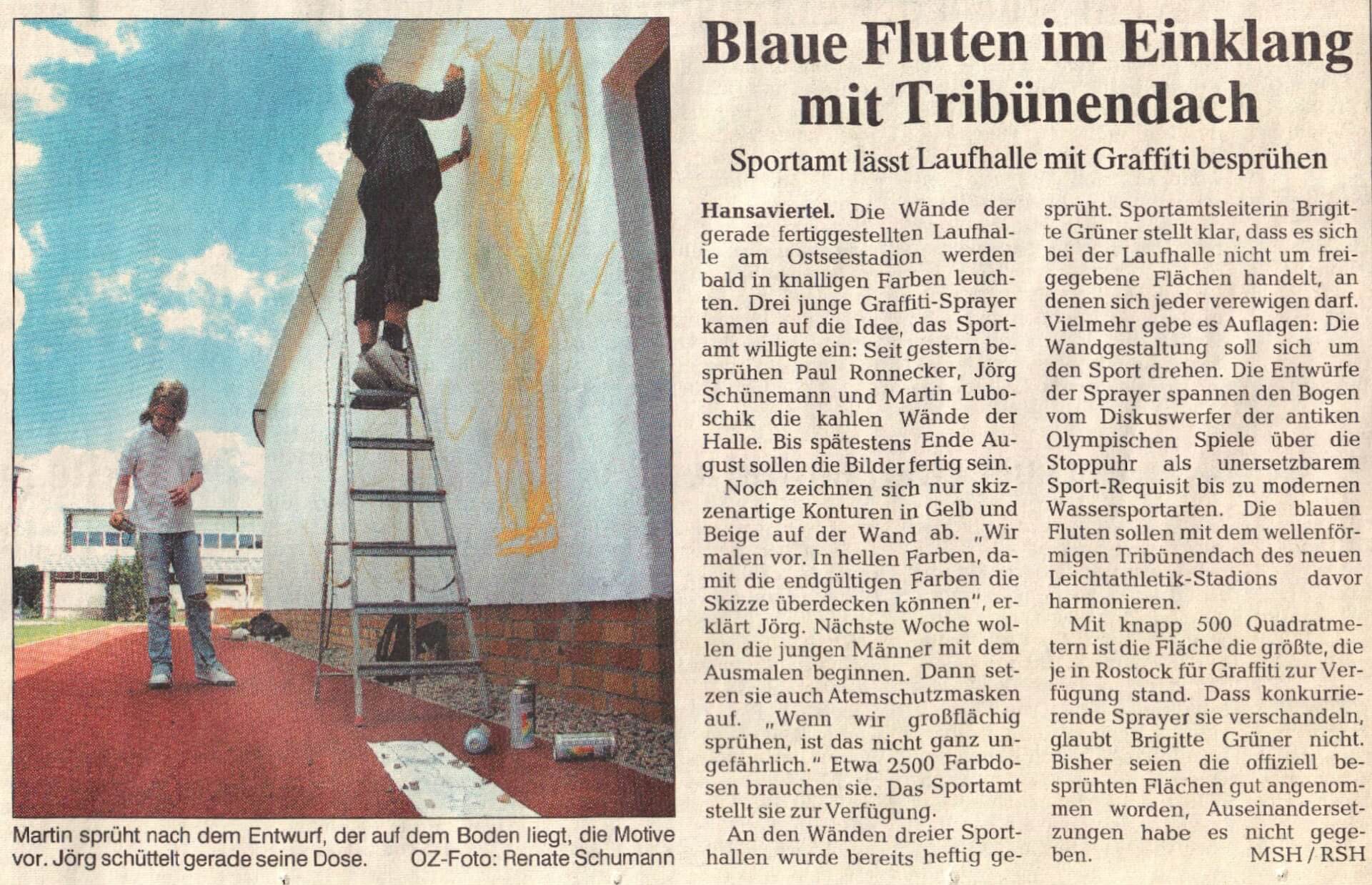Presseartikel über die 500qm-Wandgestaltung am Leichtathletik-Stadion in Rostock. Pressebericht über die Wandgestaltung am Stadion im Hansaviertel Rostock mit Wassersportmotiven.